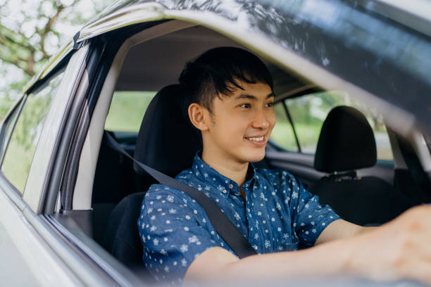 image of an asian chinese driver sitting in car and driving